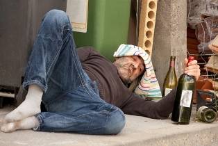 Hopeless drunk lying on the street